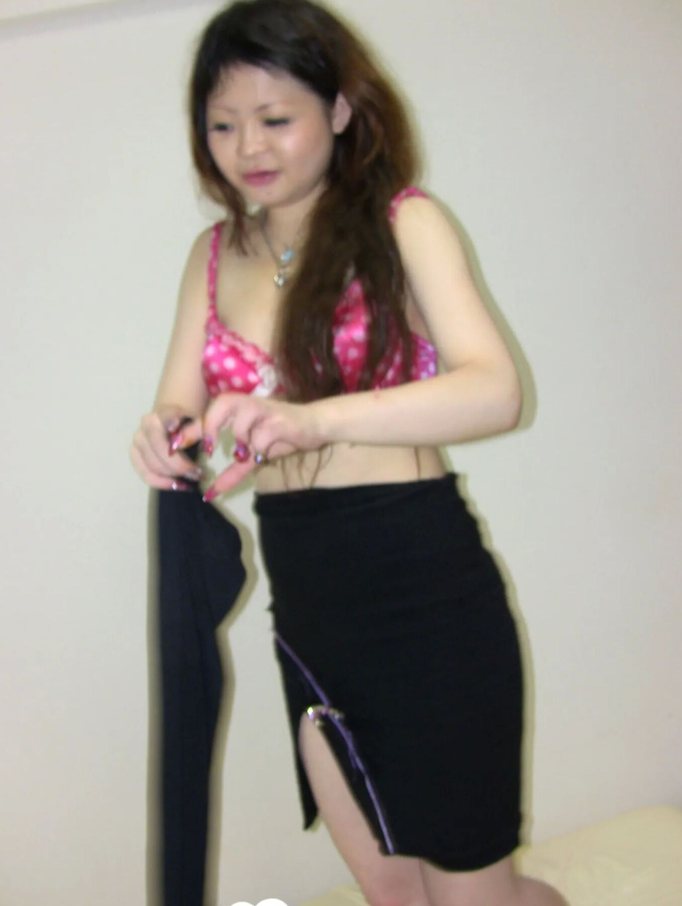 Stunning Asian gets completely naked on camera