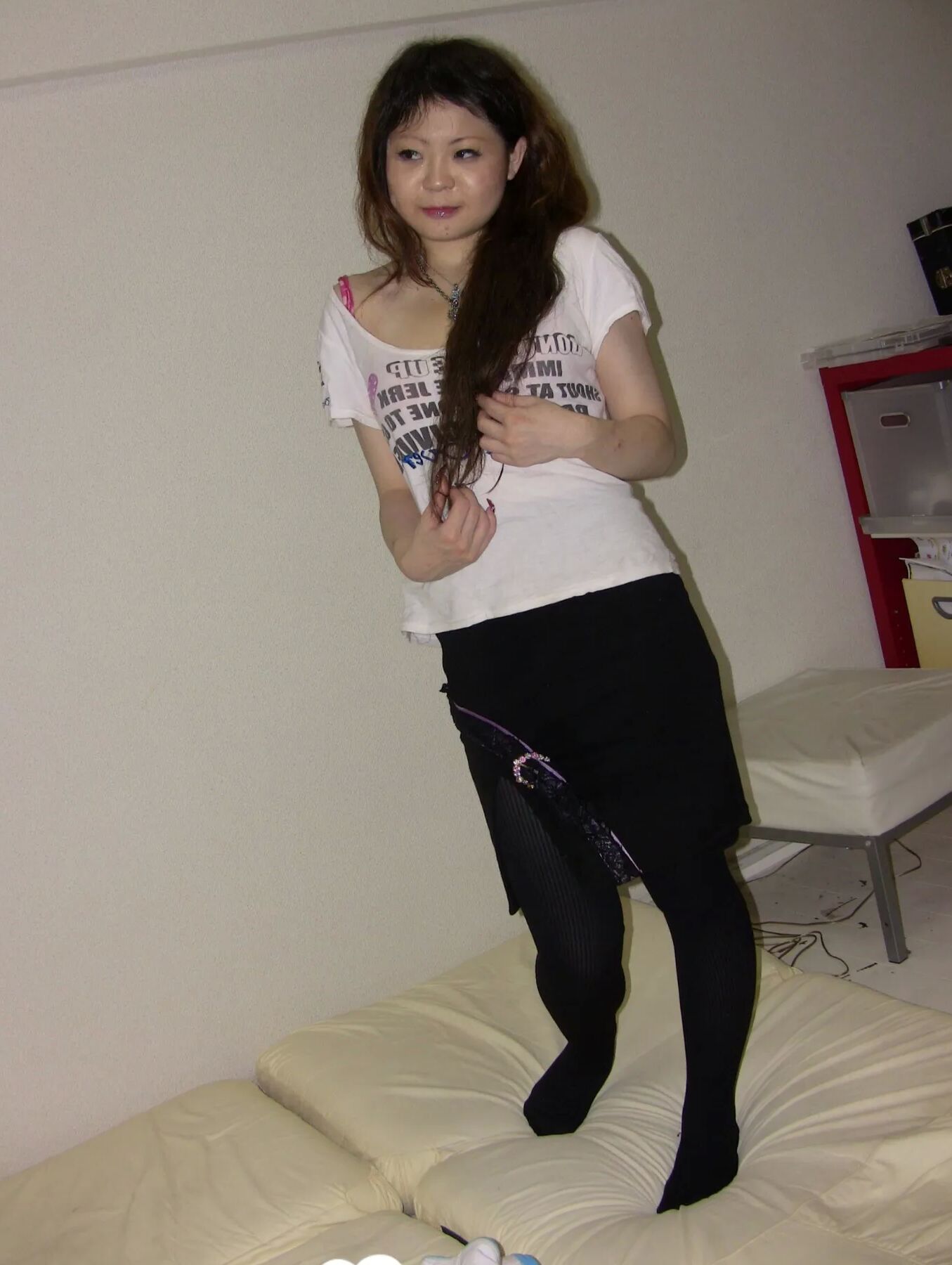 Stunning Asian gets completely naked on camera
