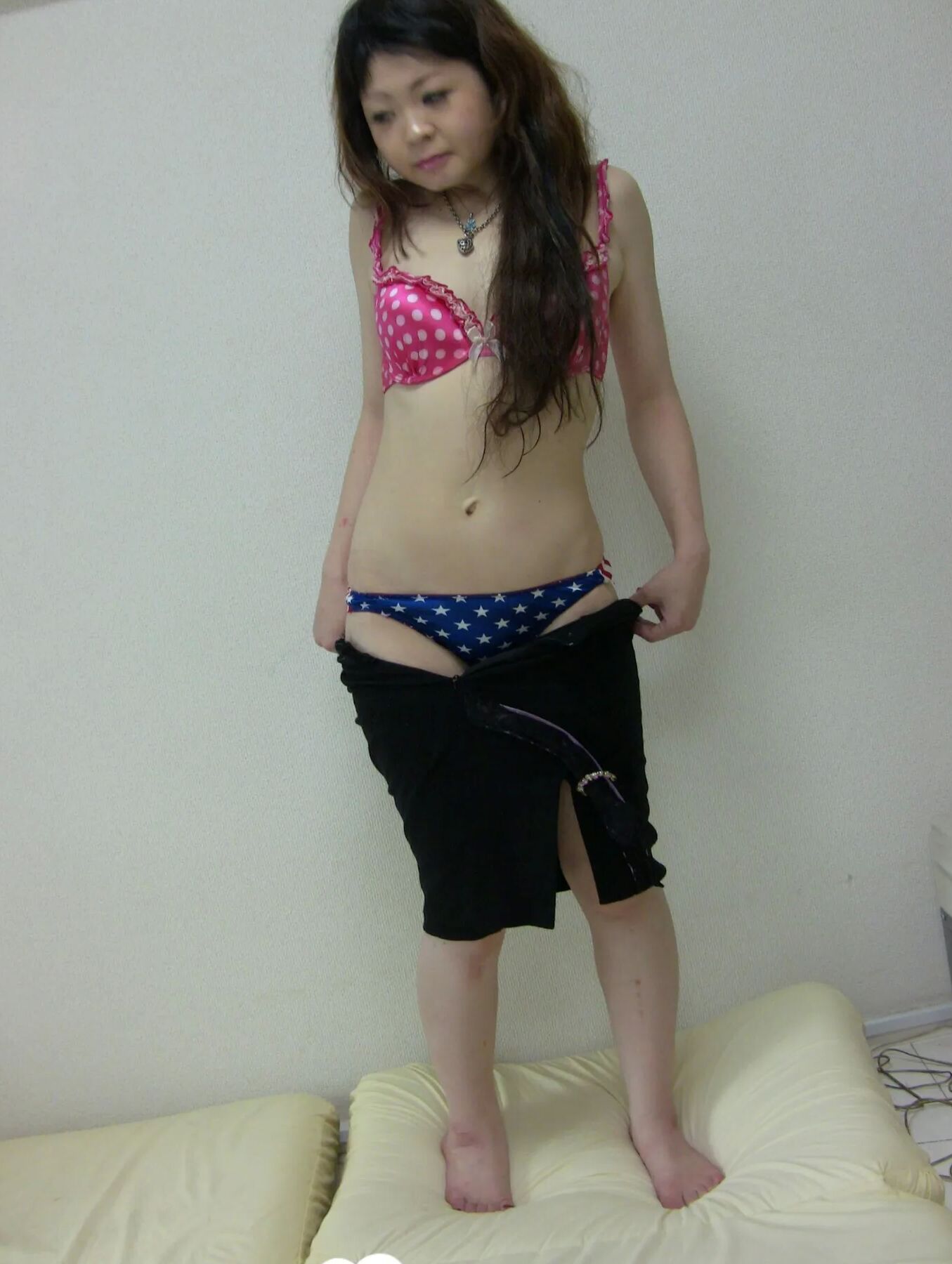 Stunning Asian gets completely naked on camera