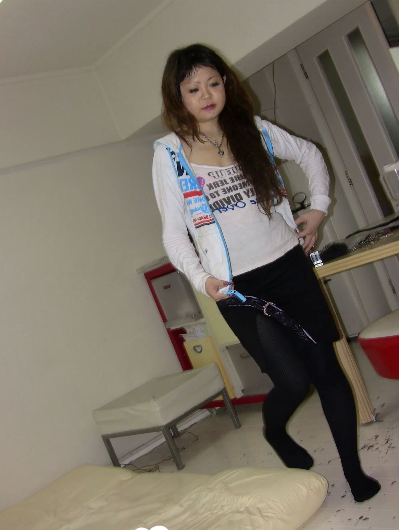 Stunning Asian gets completely naked on camera