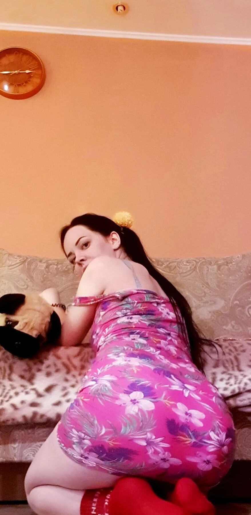 Brunette with pigtails poses in knee socks