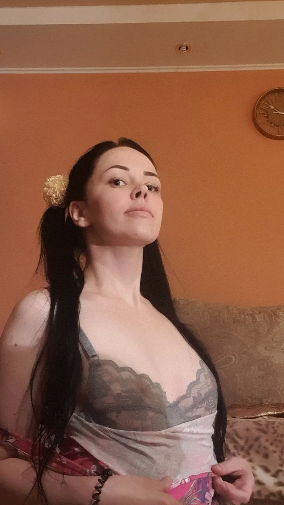 Brunette with pigtails poses in knee socks