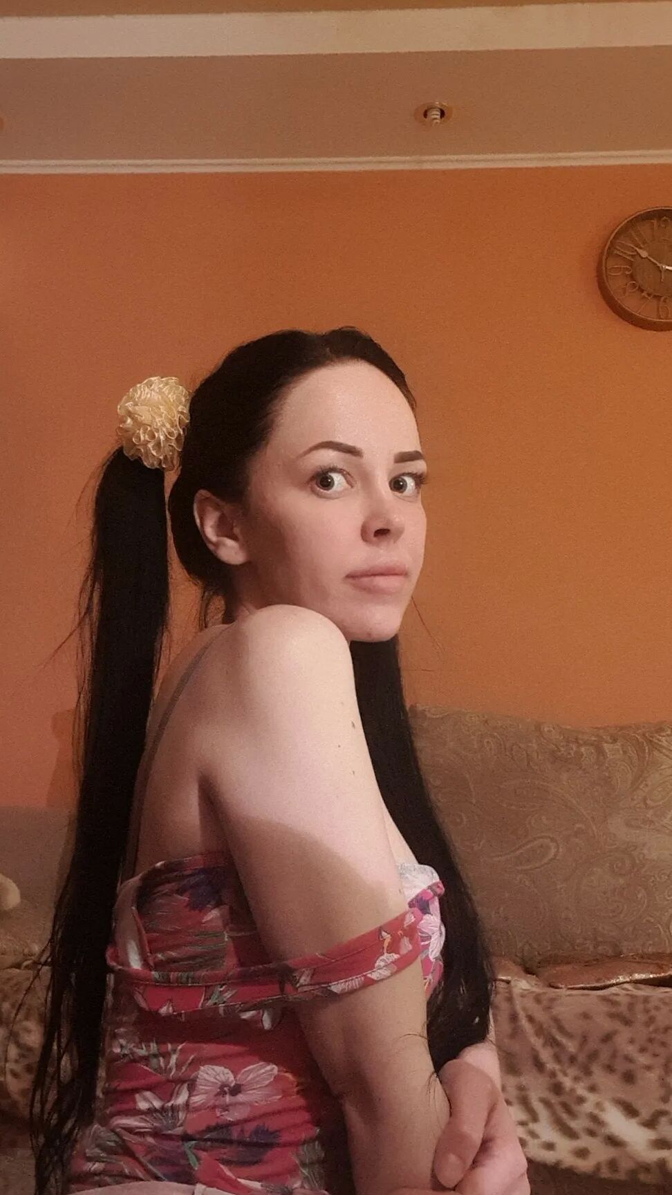 Brunette with pigtails poses in knee socks