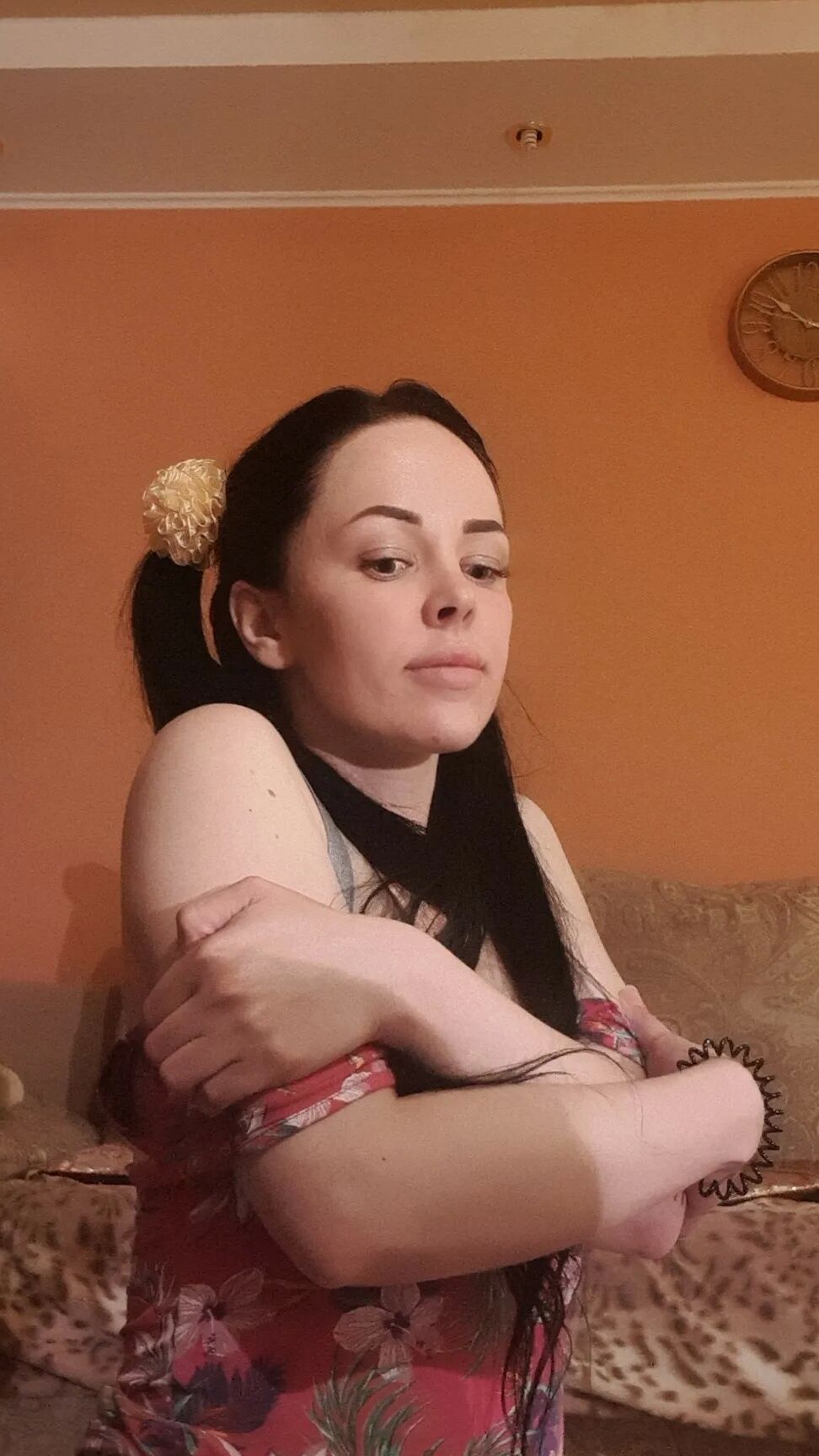 Brunette with pigtails poses in knee socks