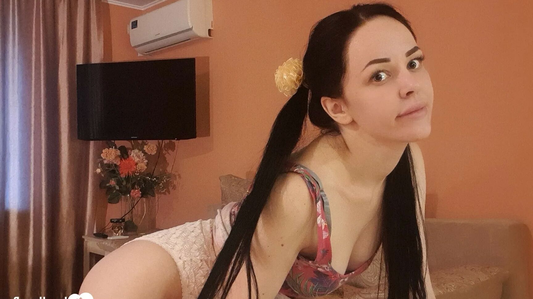 Brunette with pigtails poses in knee socks