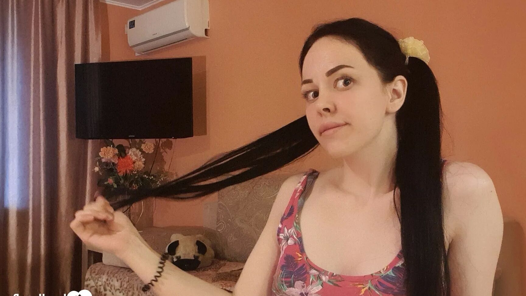 Brunette with pigtails poses in knee socks