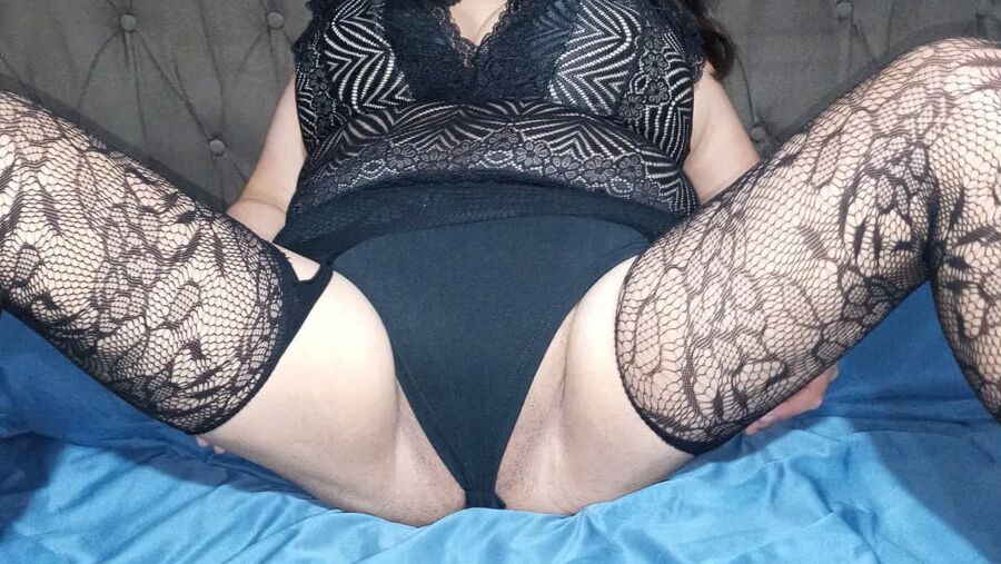 SHOWING THE VERY HOT BLACK LINGERIE LAYING ON THE BED...