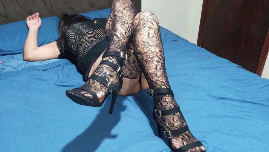 SHOWING THE VERY HOT BLACK LINGERIE LAYING ON THE BED...