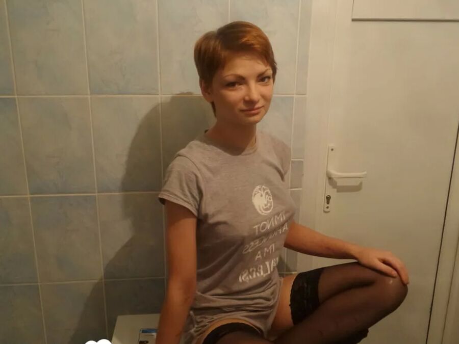 Babe in stockings taking selfies in the bathroom