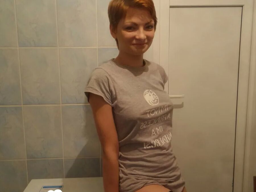 Babe in stockings taking selfies in the bathroom