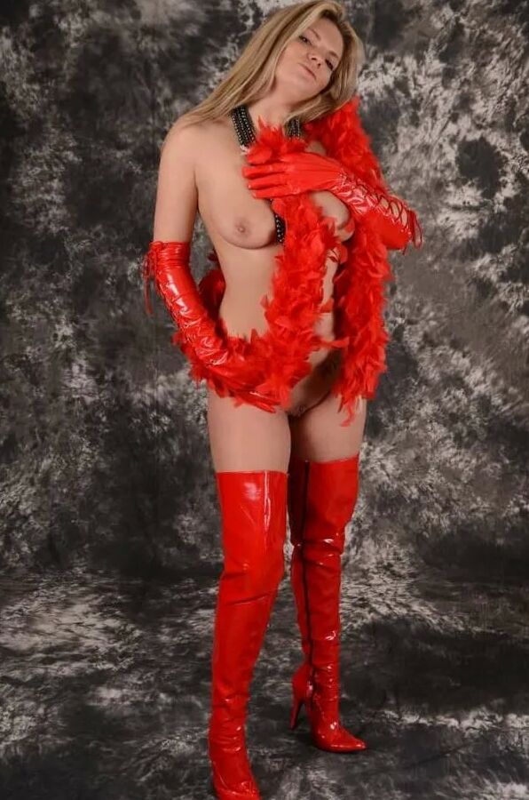 MILF Arabella May in red high boots, gloves & feather boa
