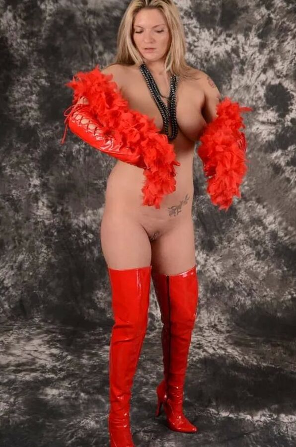 MILF Arabella May in red high boots, gloves & feather boa
