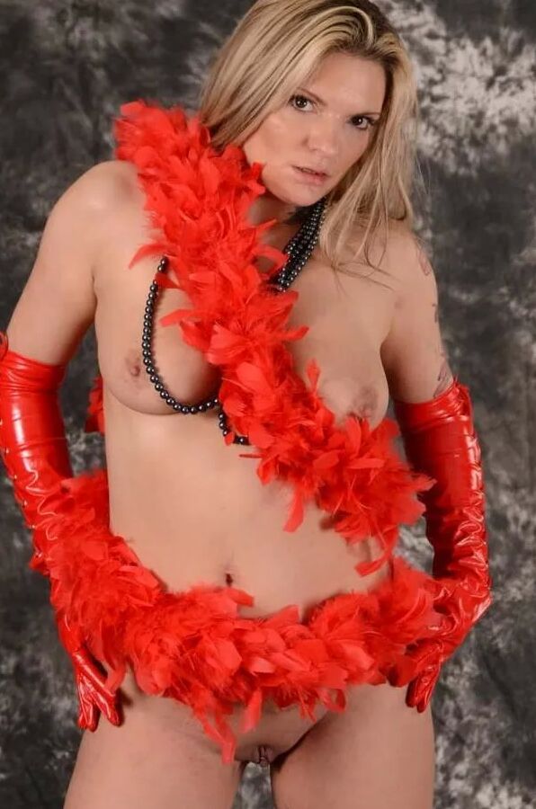 MILF Arabella May in red high boots, gloves & feather boa