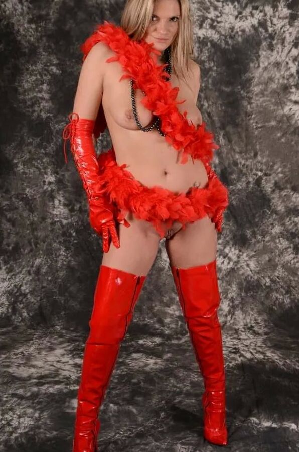 MILF Arabella May in red high boots, gloves & feather boa