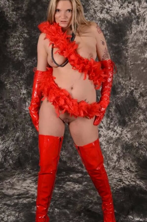 MILF Arabella May in red high boots, gloves & feather boa