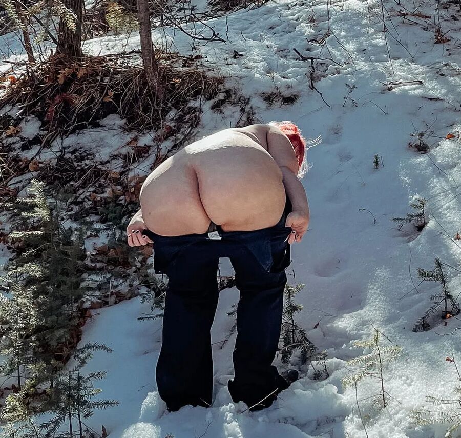 Deeper in the woods Naked and bent over in the snow