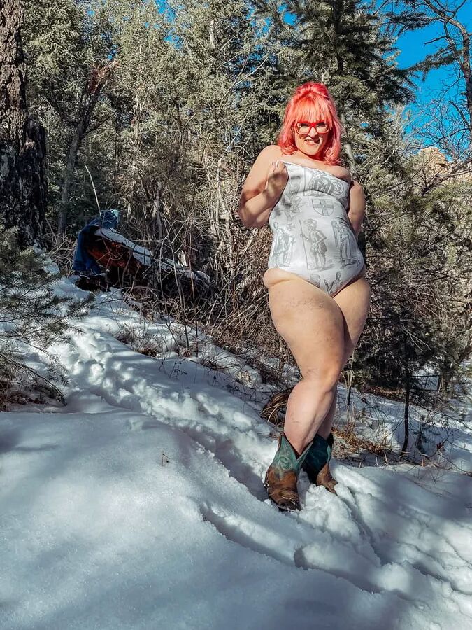 Deeper in the woods Naked and bent over in the snow