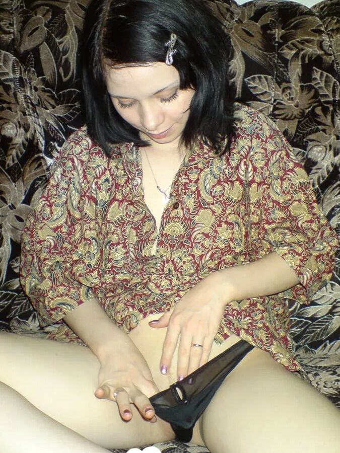 Smoking wife using a long metal dildo
