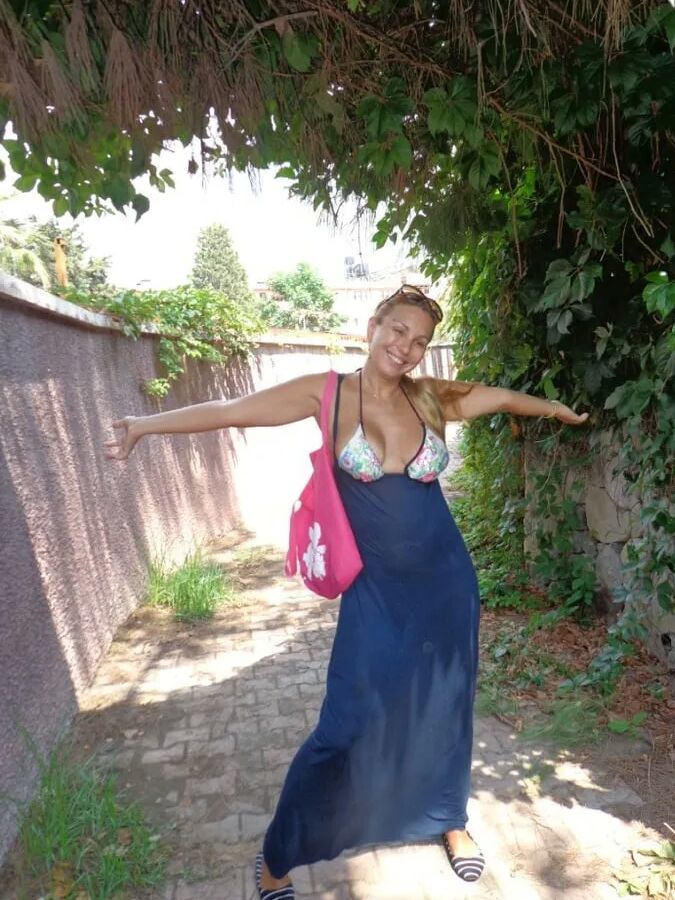Blonde Milf Lifting Her Dress To Expose Shaved Pussy