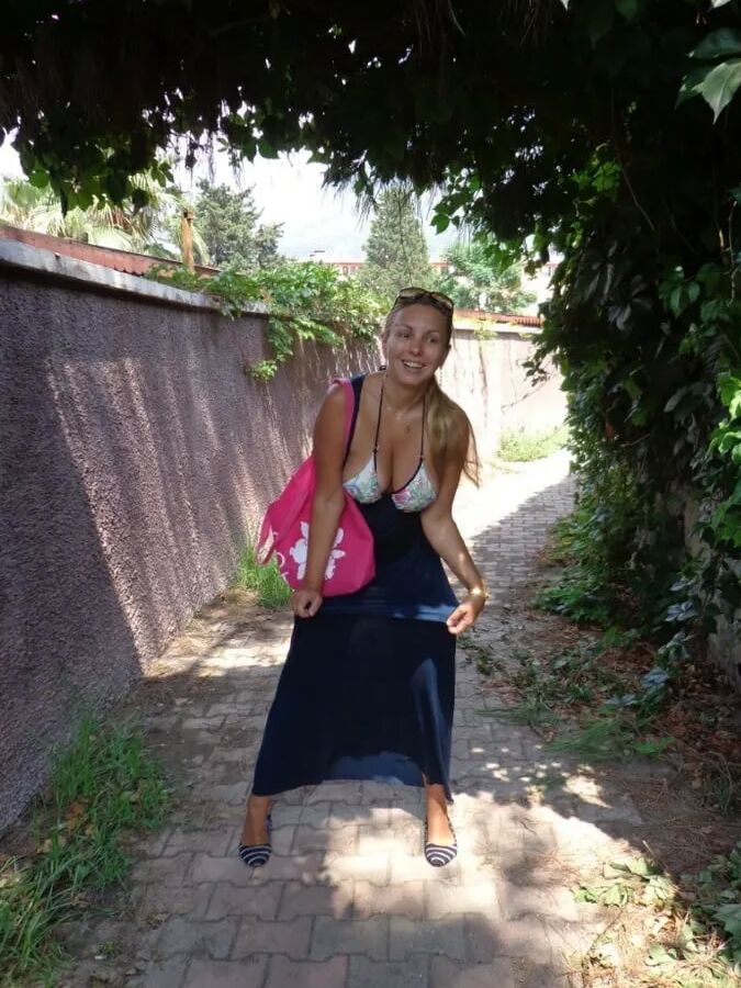 Blonde Milf Lifting Her Dress To Expose Shaved Pussy