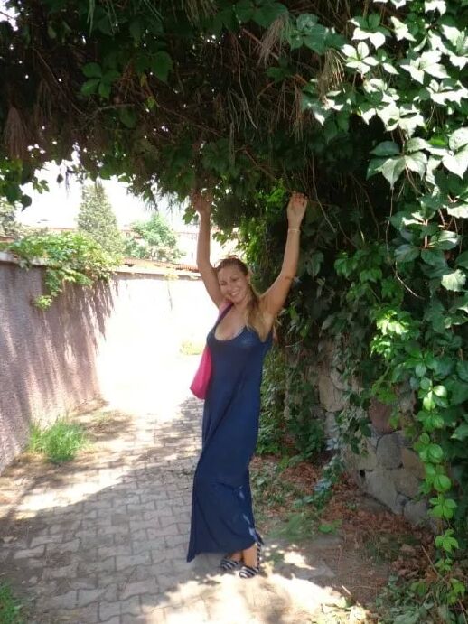 Blonde Milf Lifting Her Dress To Expose Shaved Pussy
