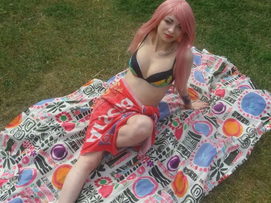Pink-haired beauty plays with her love tunnel