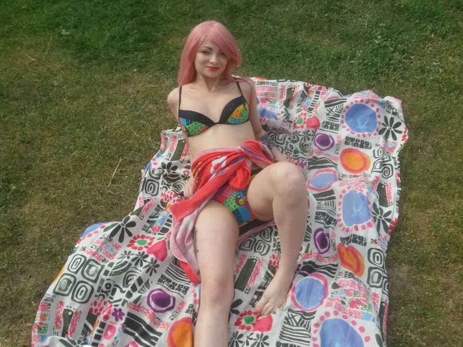 Pink-haired beauty plays with her love tunnel
