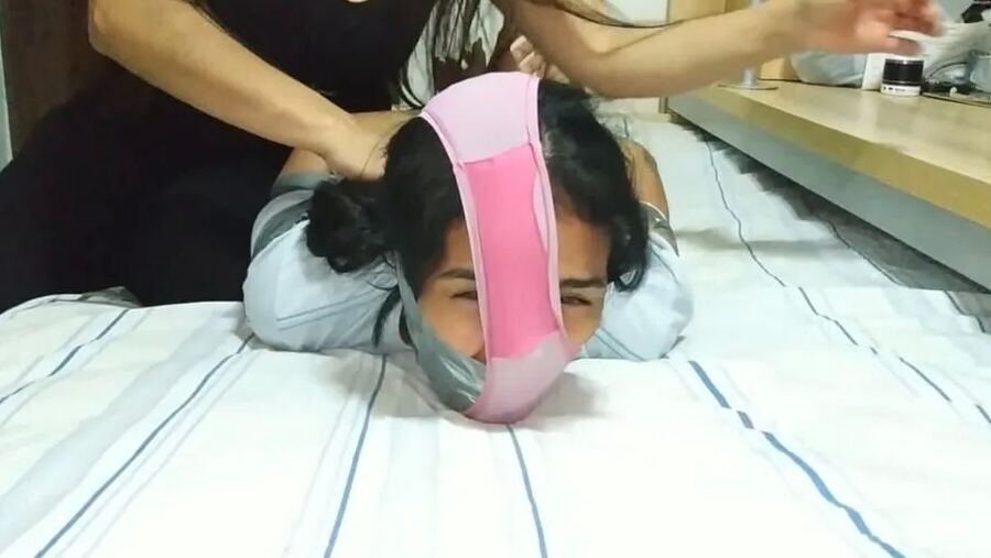 Panty Hooded Girl Gagged With Socks And Tape