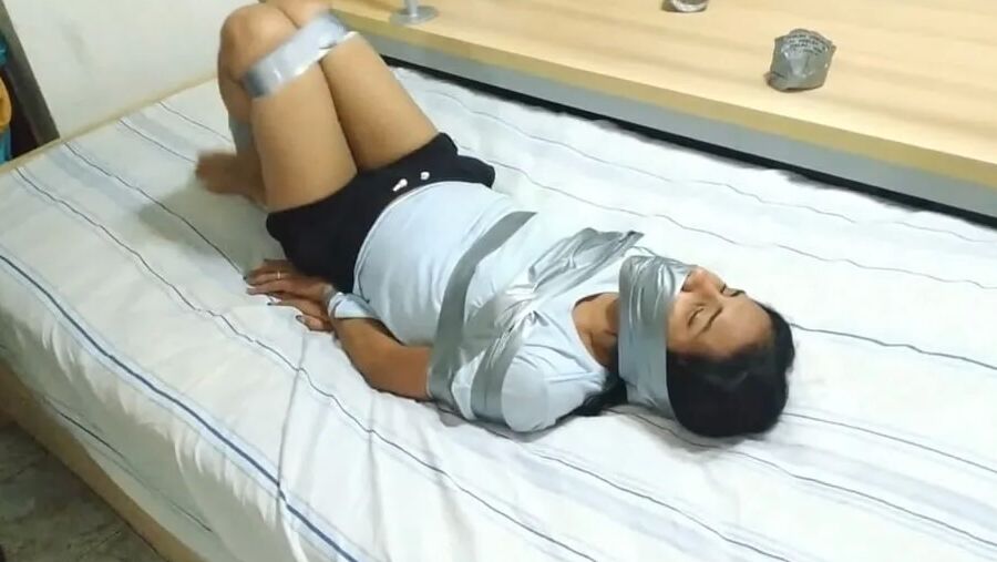 Panty Hooded Girl Gagged With Socks And Tape