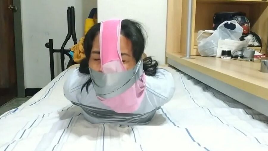Panty Hooded Girl Gagged With Socks And Tape