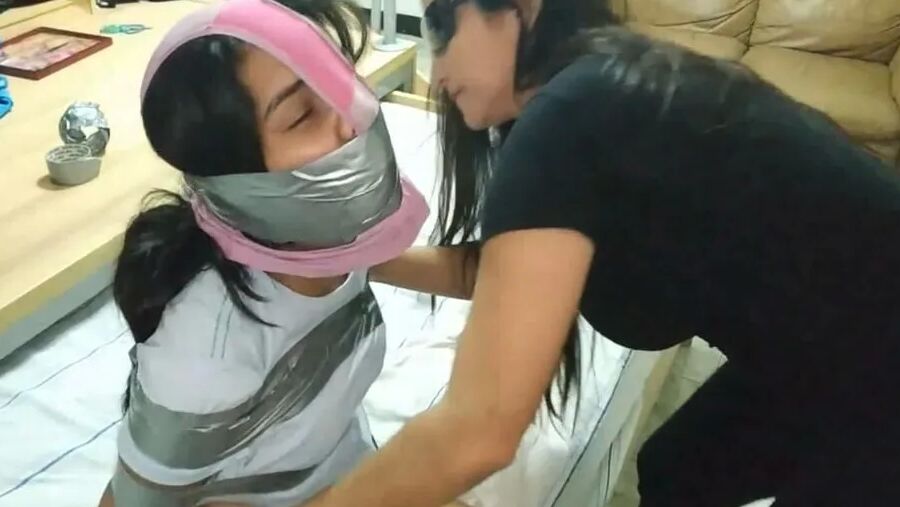 Panty Hooded Girl Gagged With Socks And Tape