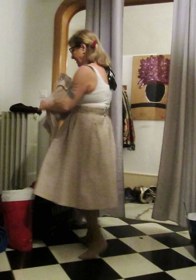 Her petticoat pressed her breasts forward