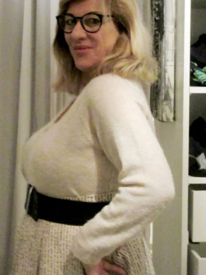 Her petticoat pressed her breasts forward