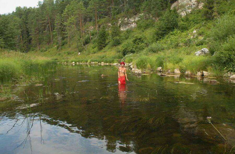 With Horns In Red Dress In Shallow River