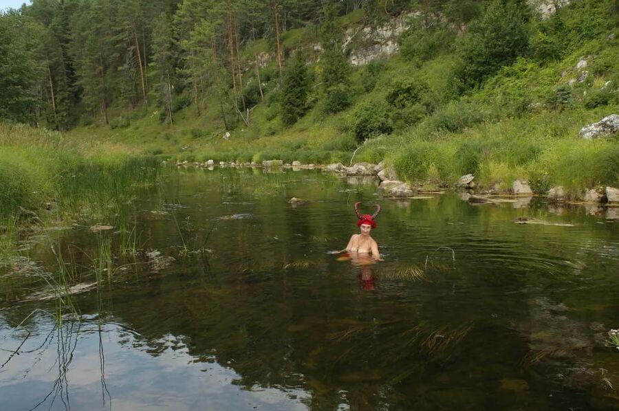 With Horns In Red Dress In Shallow River