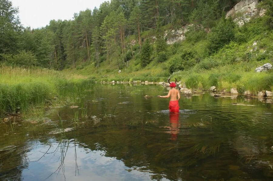 With Horns In Red Dress In Shallow River