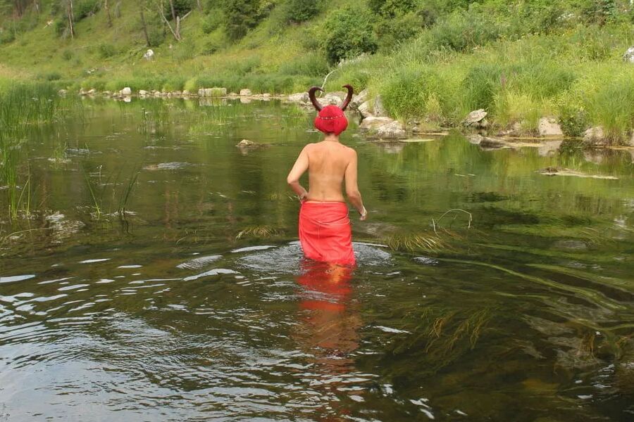 With Horns In Red Dress In Shallow River