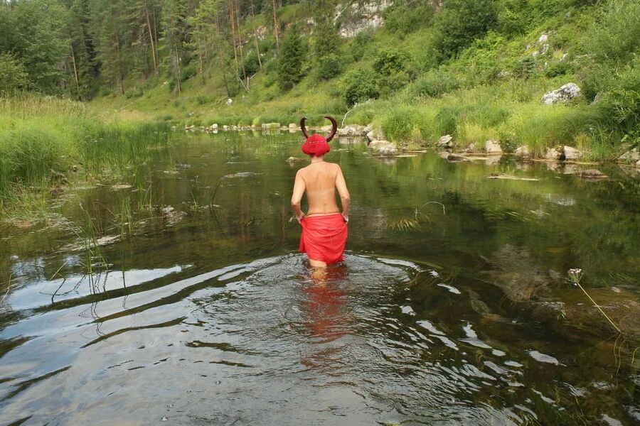 With Horns In Red Dress In Shallow River
