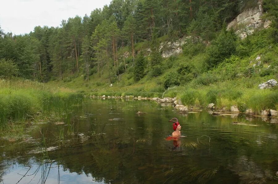 With Horns In Red Dress In Shallow River