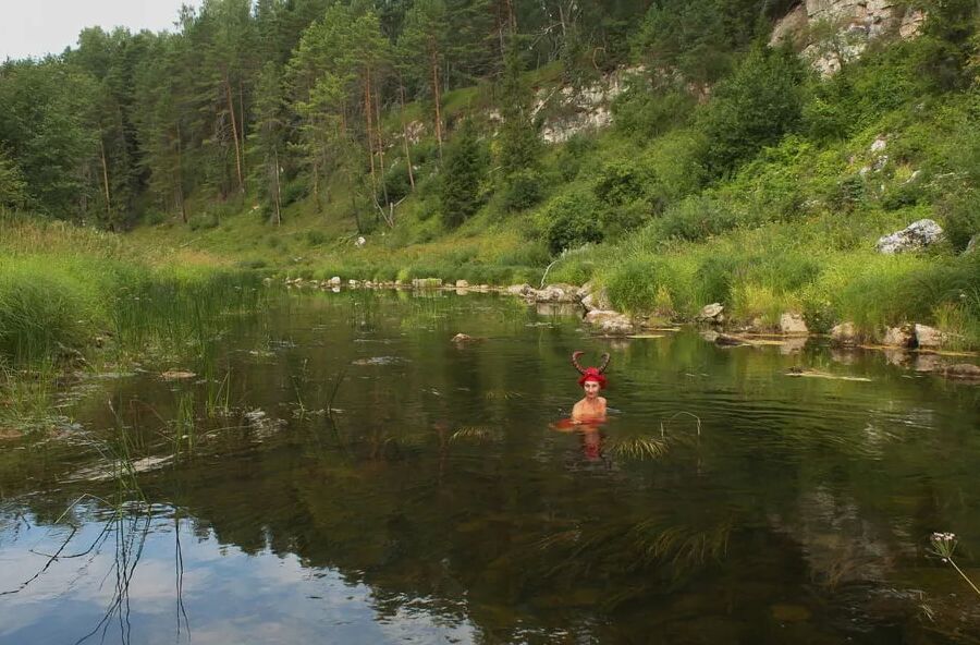 With Horns In Red Dress In Shallow River
