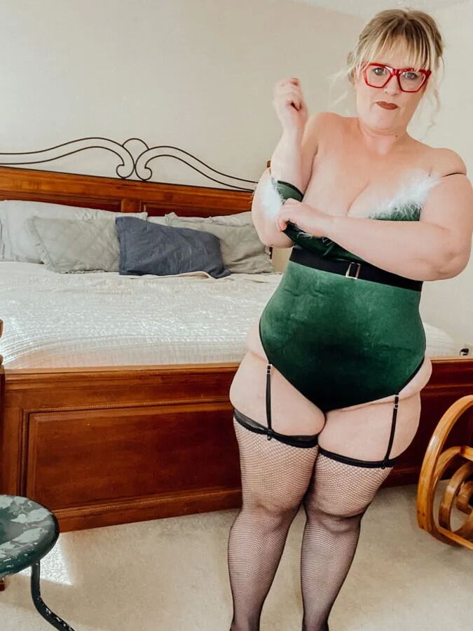 BBW Christmas Elf in Fishnet Thigh Highs and Heels