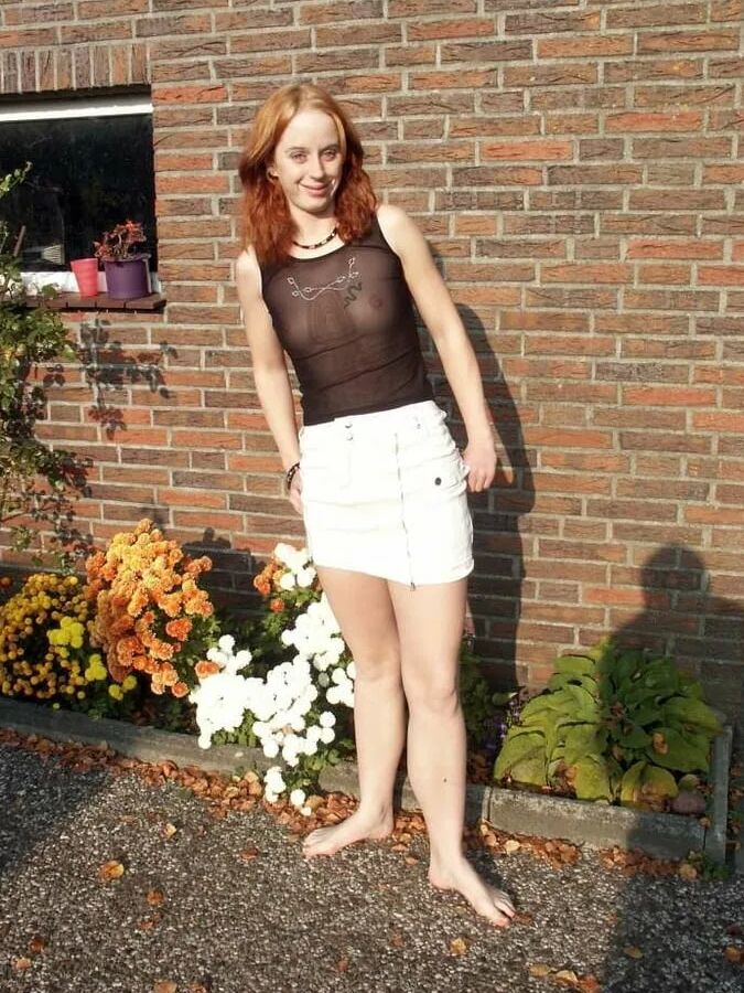 Photo shooting with schoolgirl Claudia outdoor in the garden