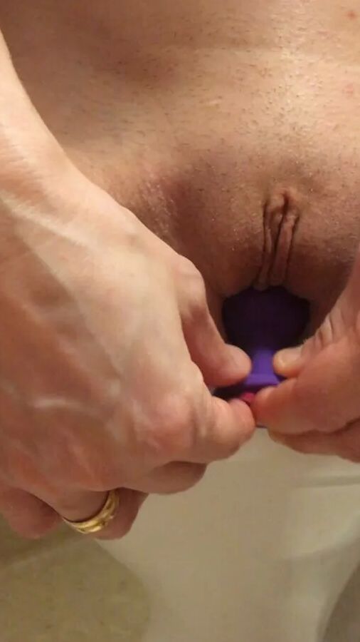 Playing with a dildo a little in bathroom