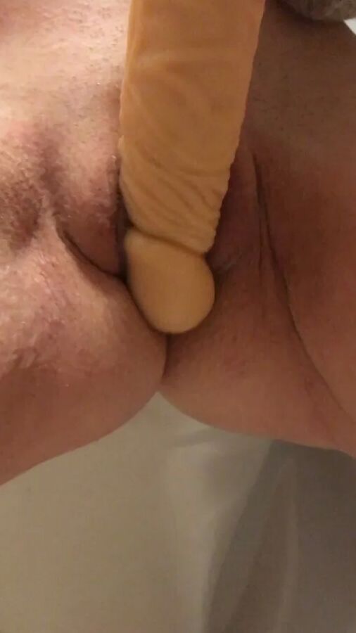 Playing with a dildo a little