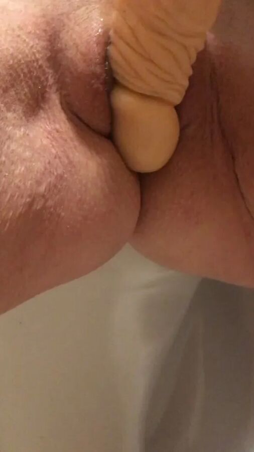 Playing with a dildo a little