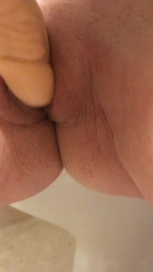 Playing with a dildo a little
