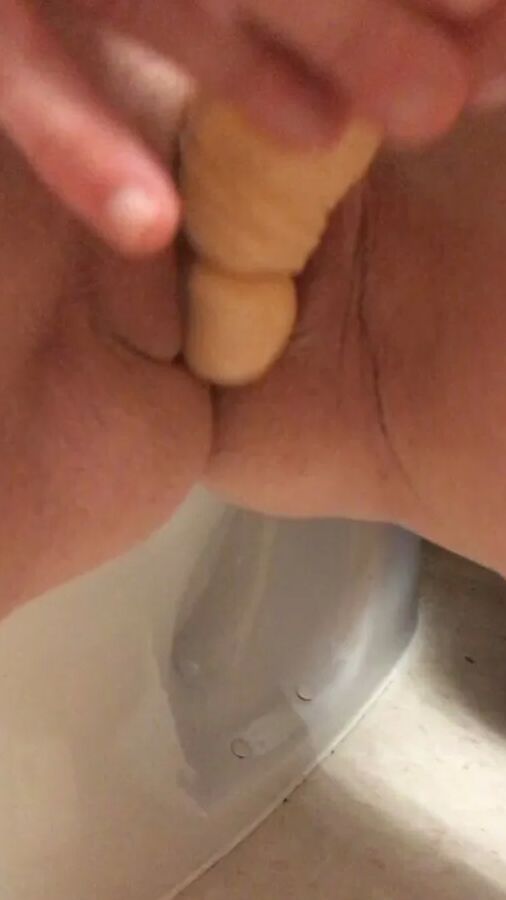 Playing with a dildo a little