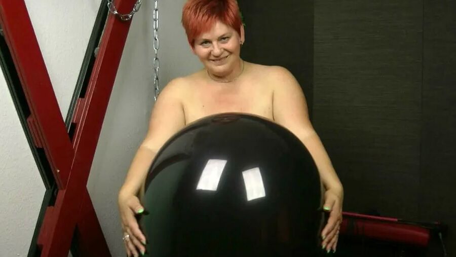 Naked with big black balloon