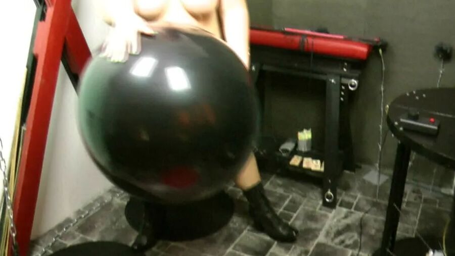 Naked with big black balloon