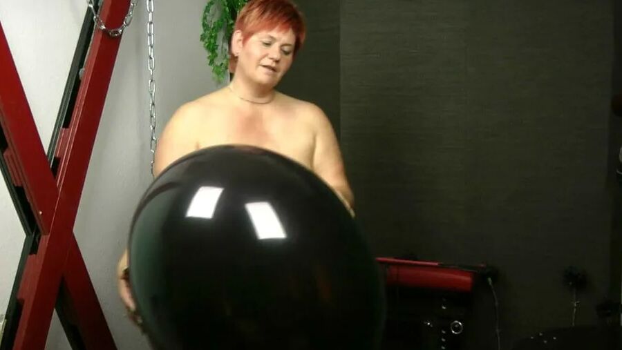 Naked with big black balloon